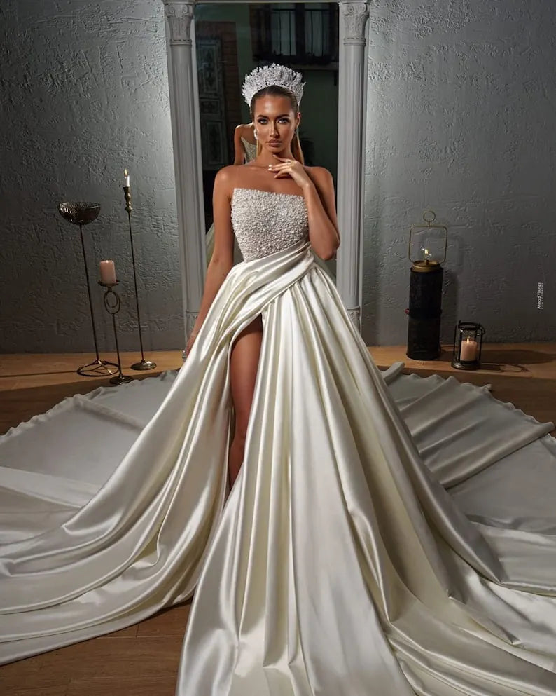 Elegant beaded satin wedding dress. Satin wedding dress with split thigh with sparkling beads