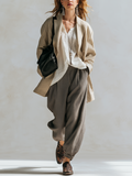 Striped Jacket Paired With A White Shirt And Brown Harem Pants Set