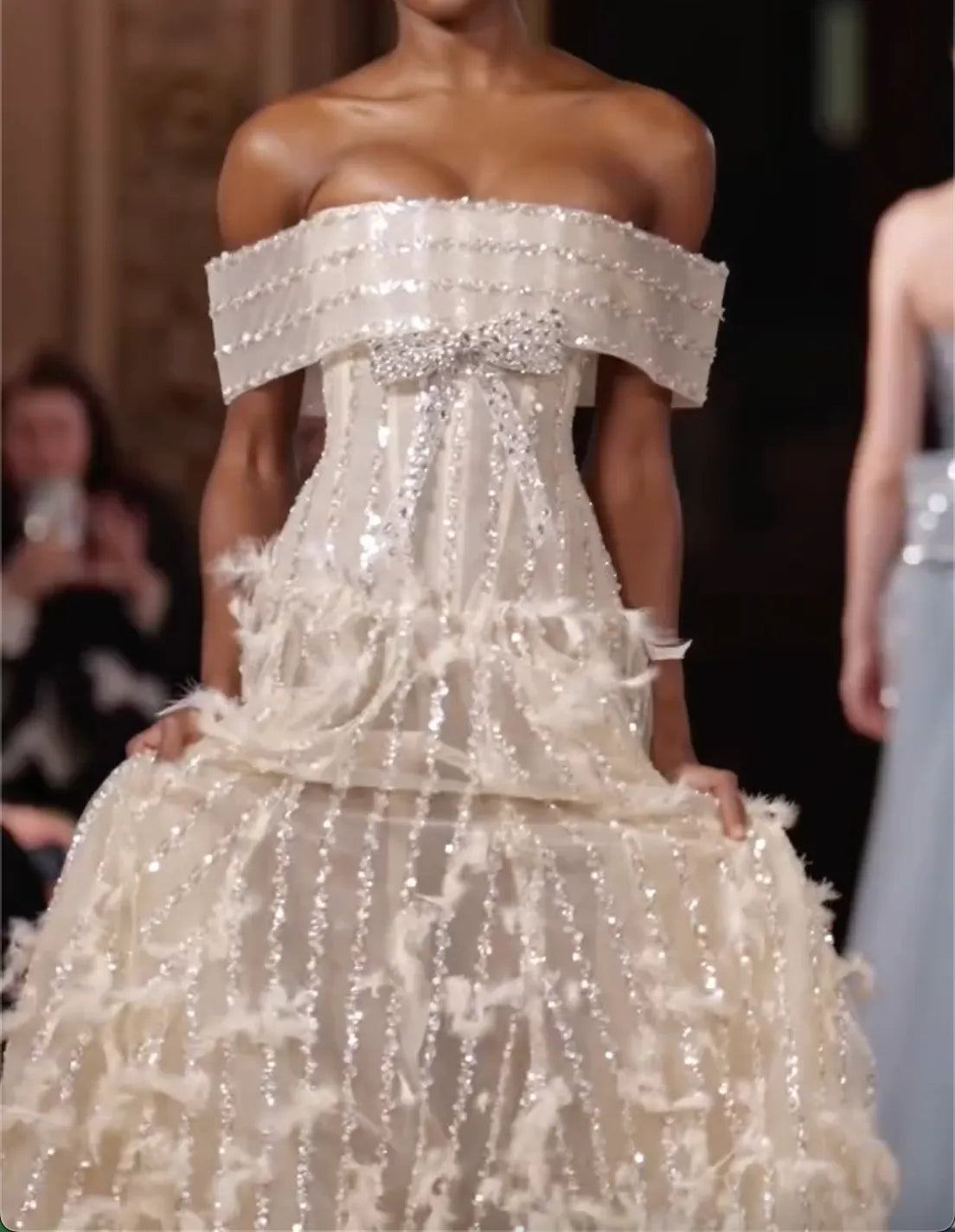 Off White Off Shoulder Rhinestone Bow Corset Feather Voluminous Tulle Train Wedding Ball Gown For Bride Gala Fashion Show Editorial Shoot