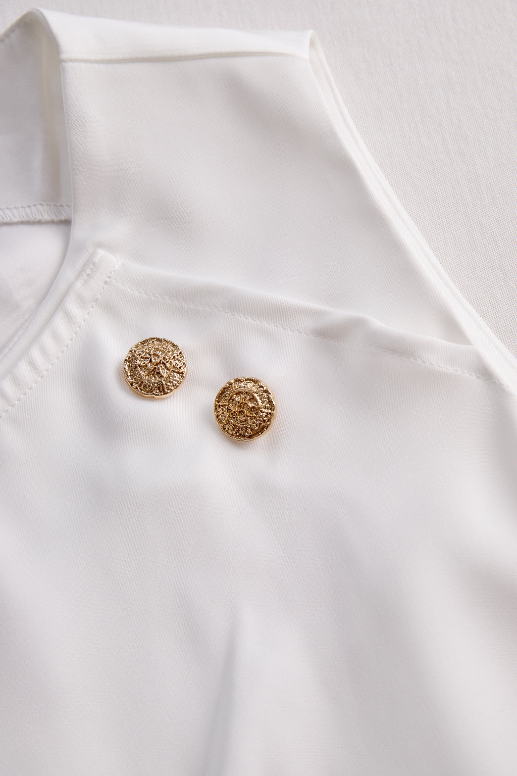 Elegant White Draped Top with Button Detail