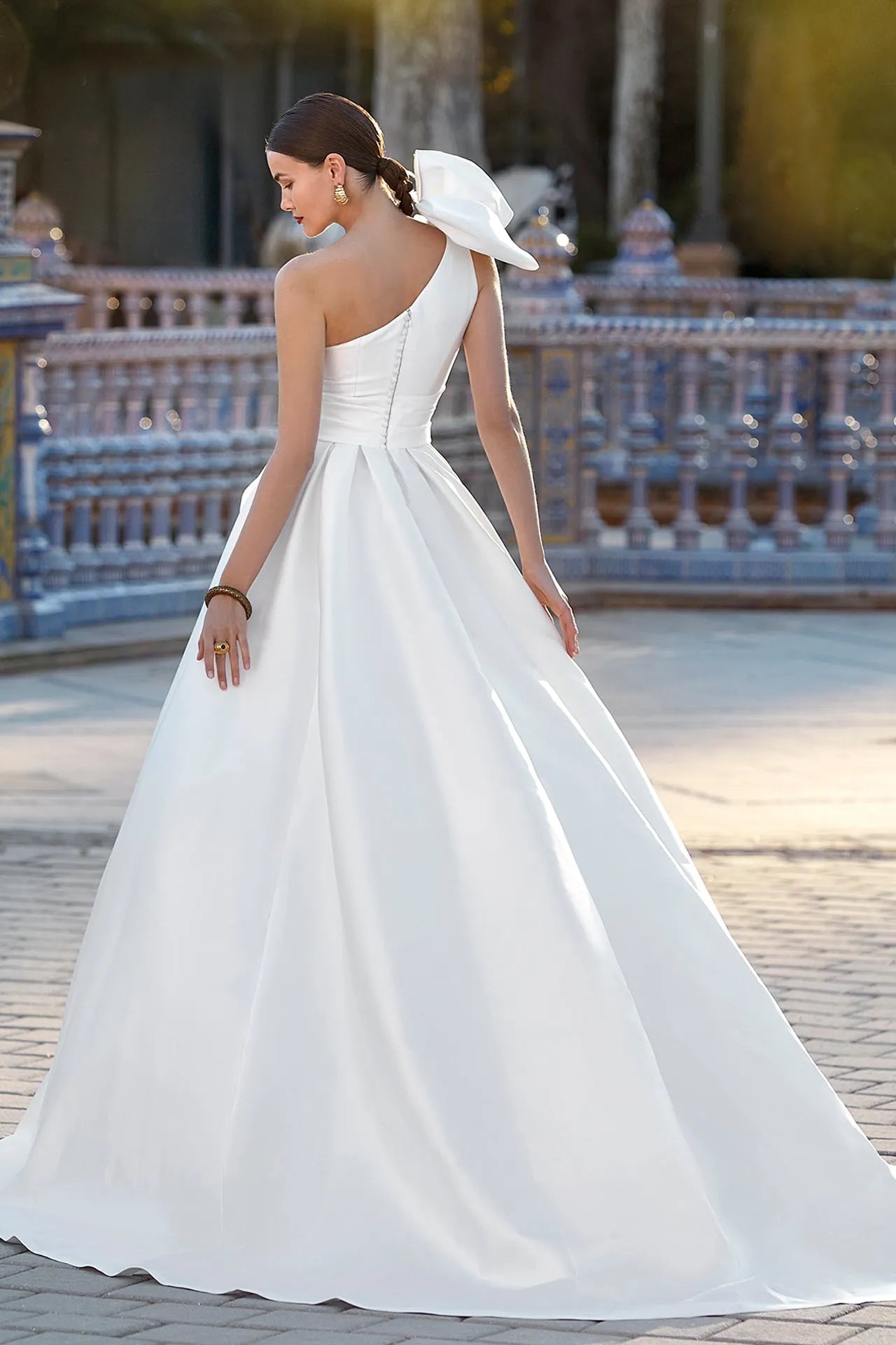 Asymmetrical neckline sleeveless wedding gown